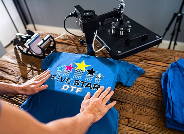 Applying a DTF transfer with a heat press at Five Star DTF in Tempe, Arizona
